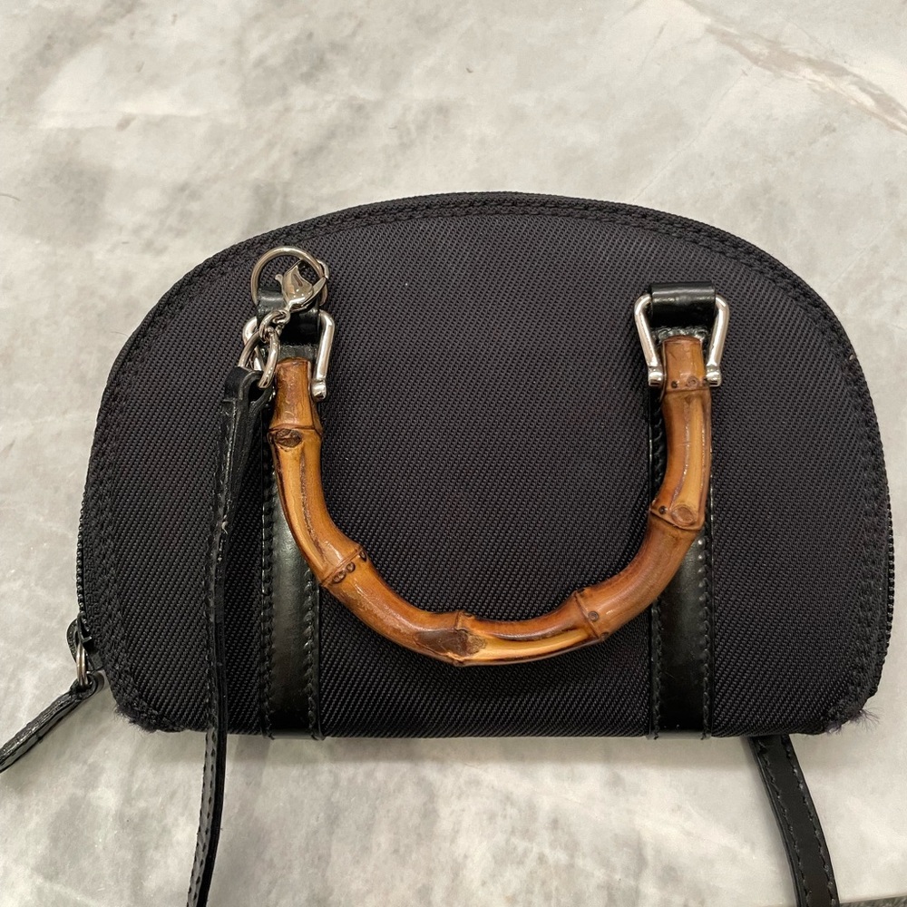 Gucci mini crossbody wallet with bamboo handles and patent leather strap